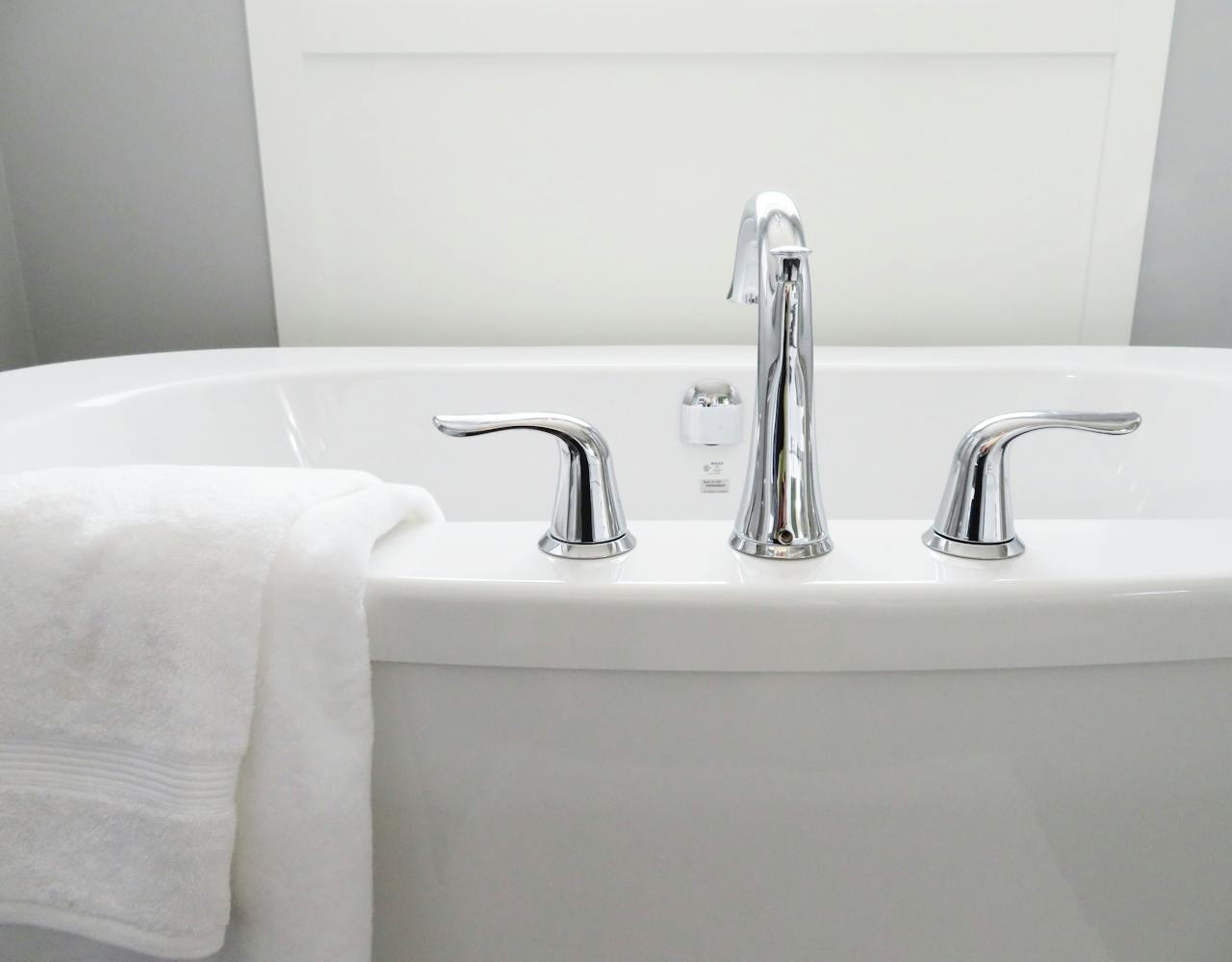 The Art of Drawing Readers In: Your attractive post title goes here Clean and modern white bathtub with chrome fixtures, perfect for sleek interior design.